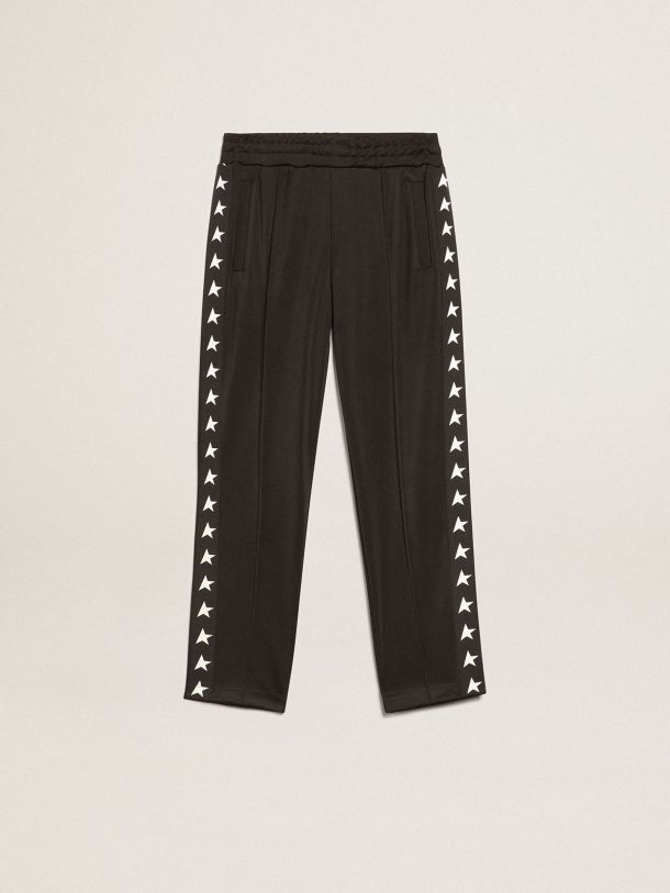 Kids’ black joggers with stars on the sides