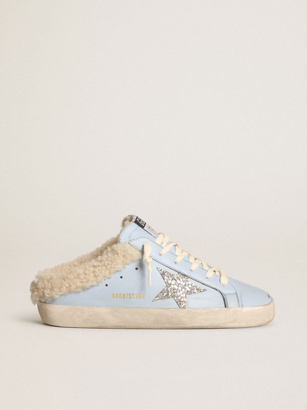 Super-Star Sabots in powder-blue leather with silver glitter star and beige shearling lining