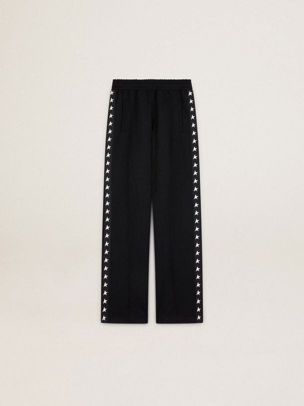 Women’s black joggers with white stars on the sides