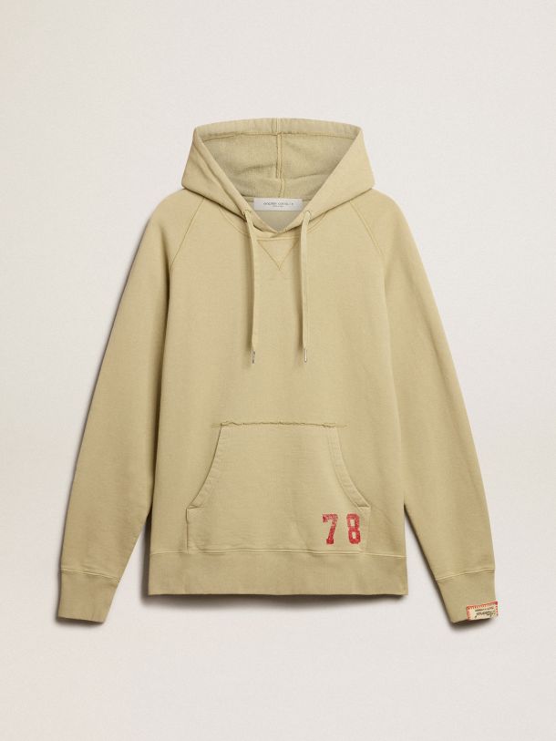 Pale eucalyptus-colored hoodie with front pocket