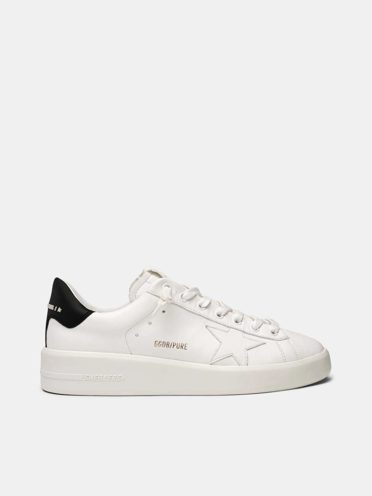 white sneakers with black heel