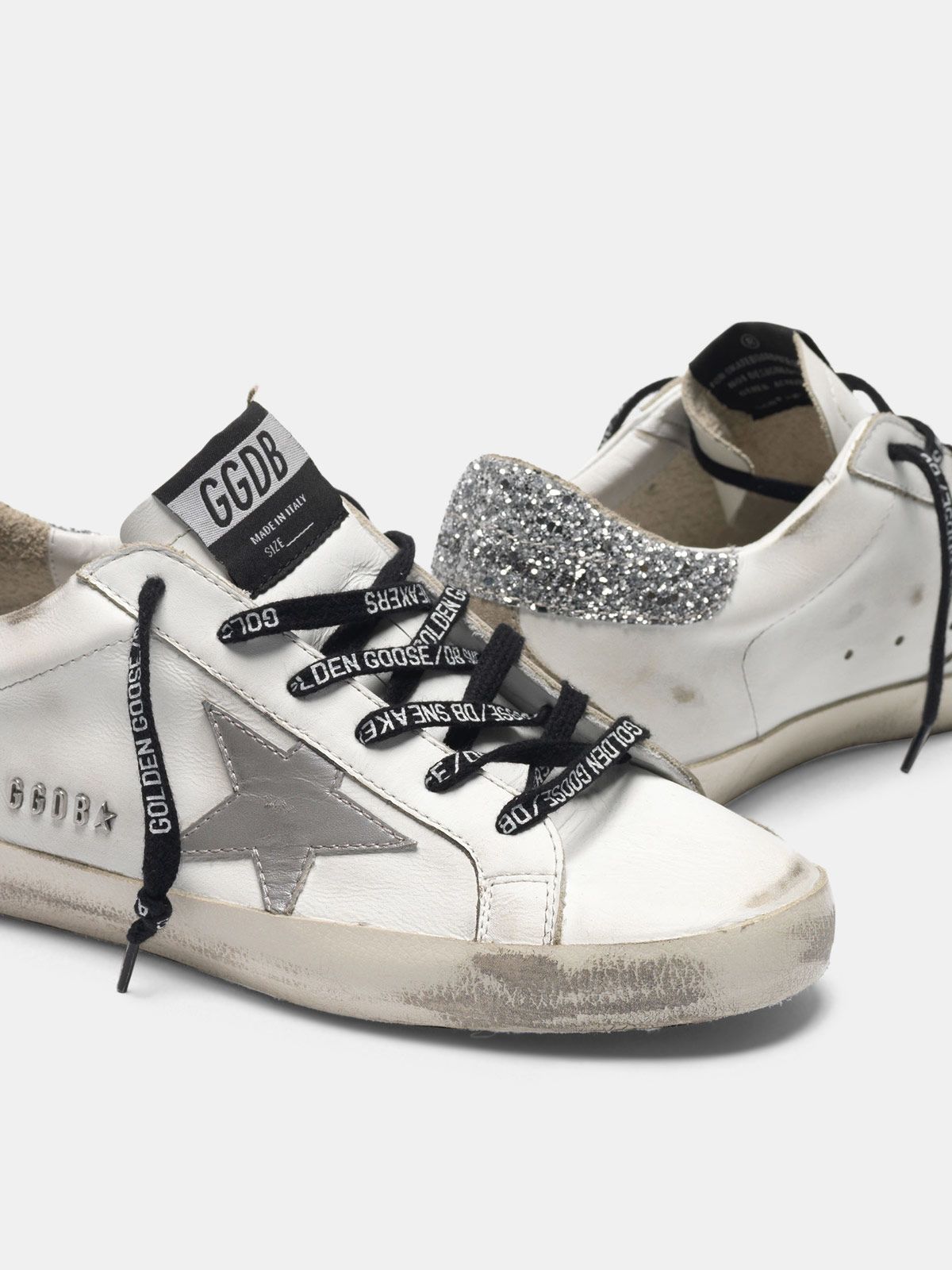 superstar sneakers with silver heel tab with glitter and metal stud lettering