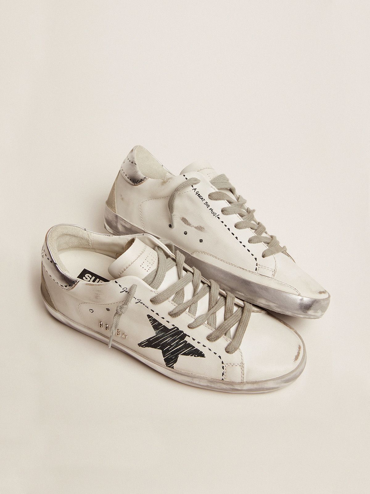 Super-Star sneakers with silver laminated leather heel tab and Super-Star sneakers with silver laminated leather heel tab and