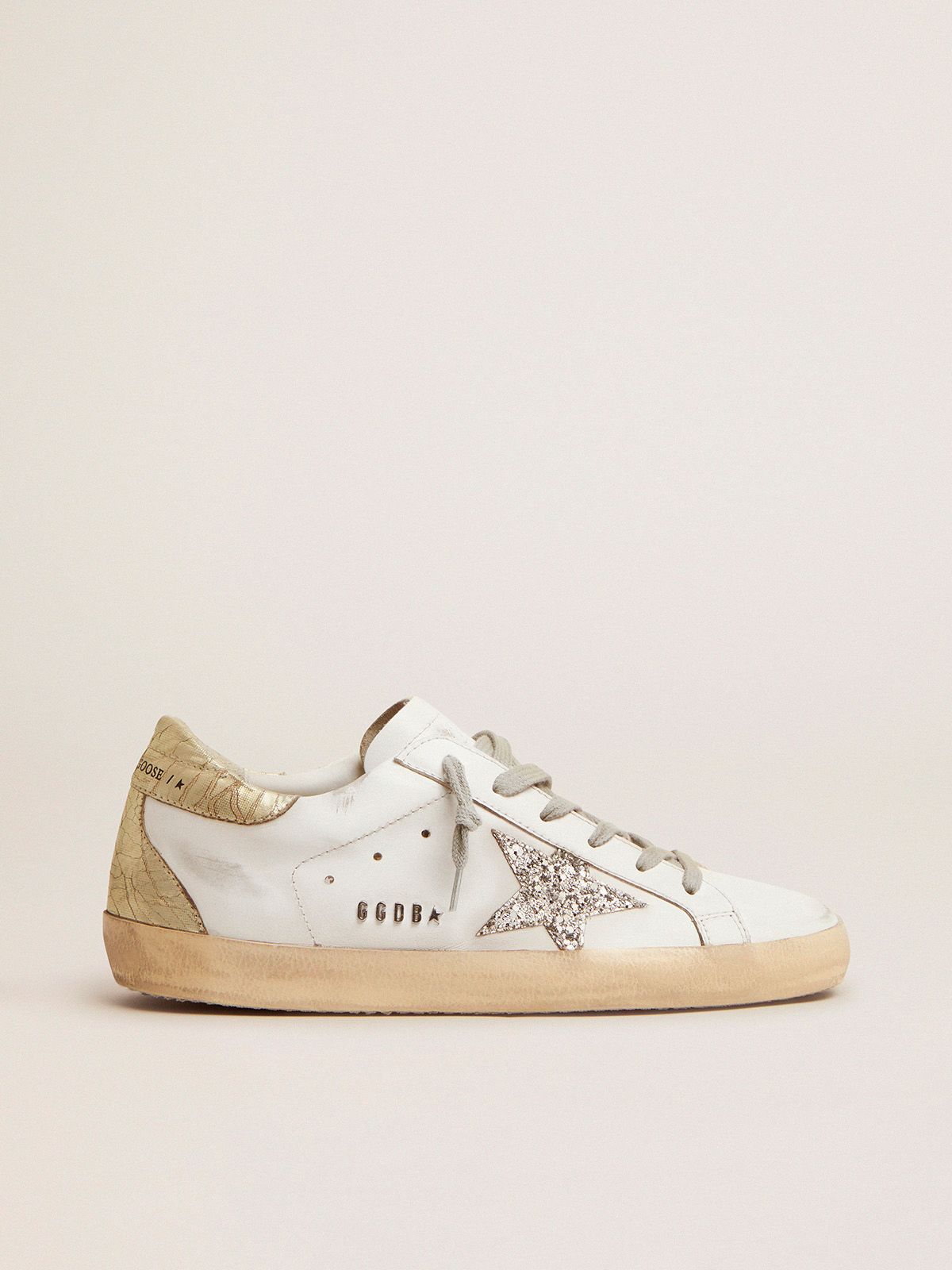 Super-Star sneakers with silver glitter star and glossy gold leather heel  tab