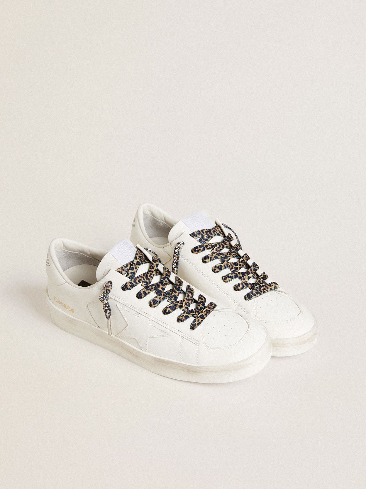 Beige and brown leopard-print laces with contrasting white logo ...