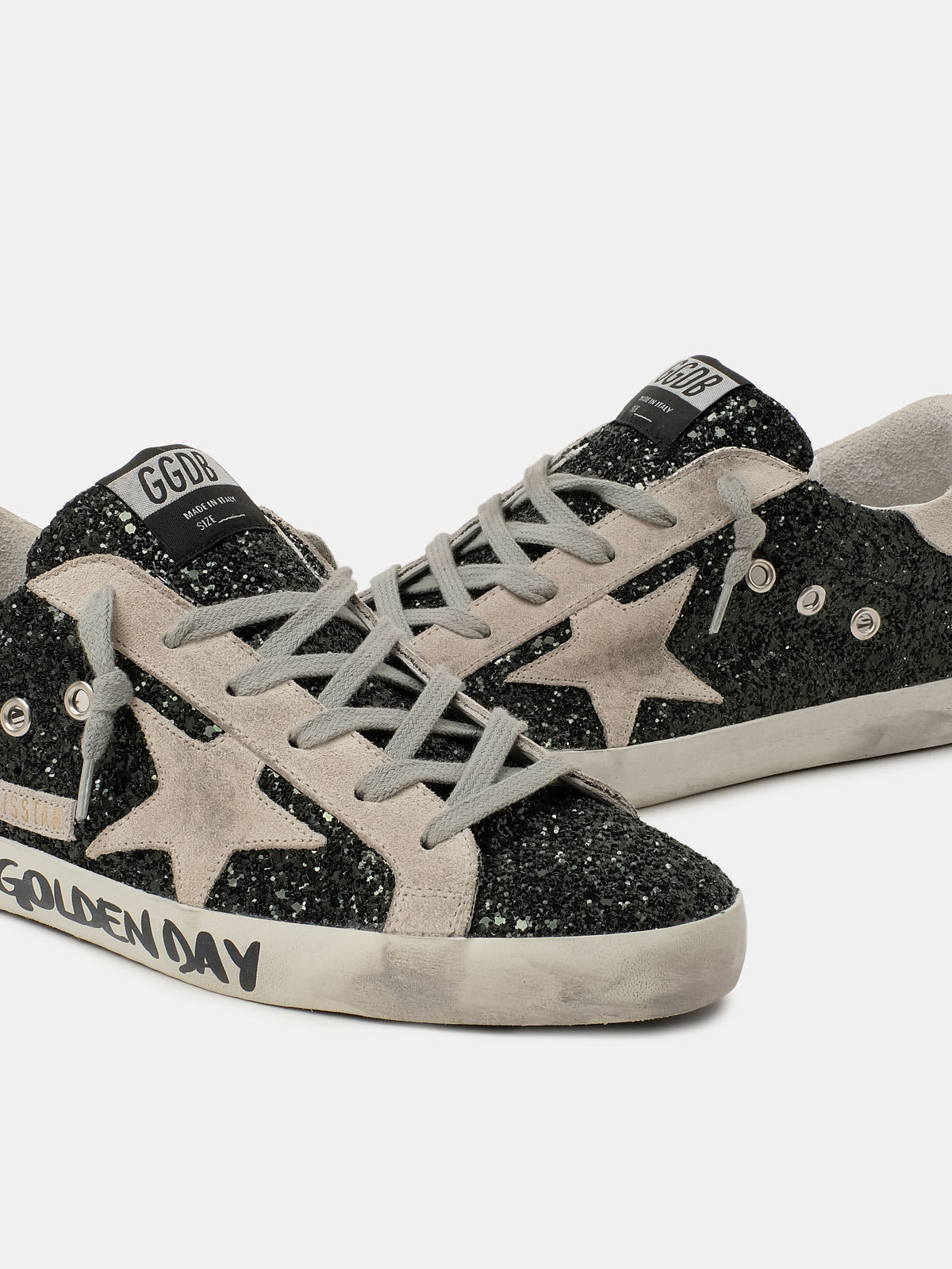 Super-Star sneakers with handwritten Love is all we need lettering