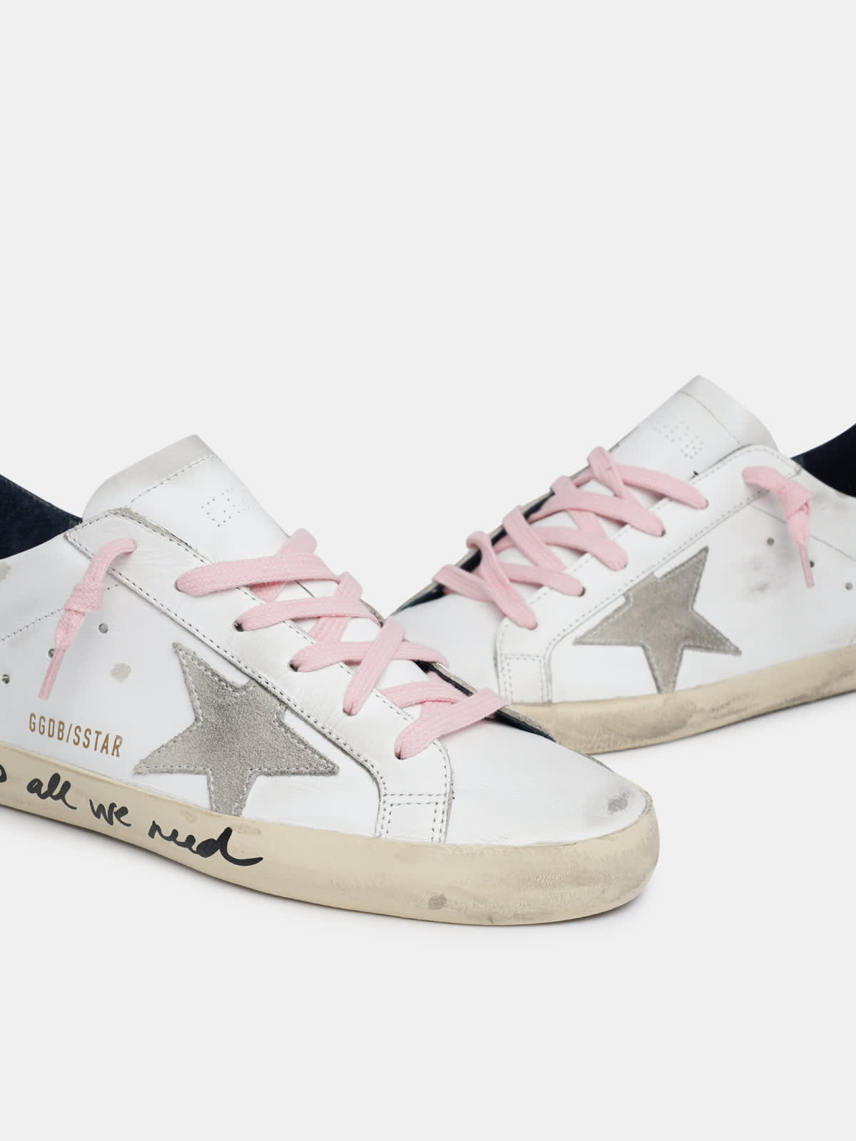 Super-Star sneakers with handwritten Love is all we need lettering