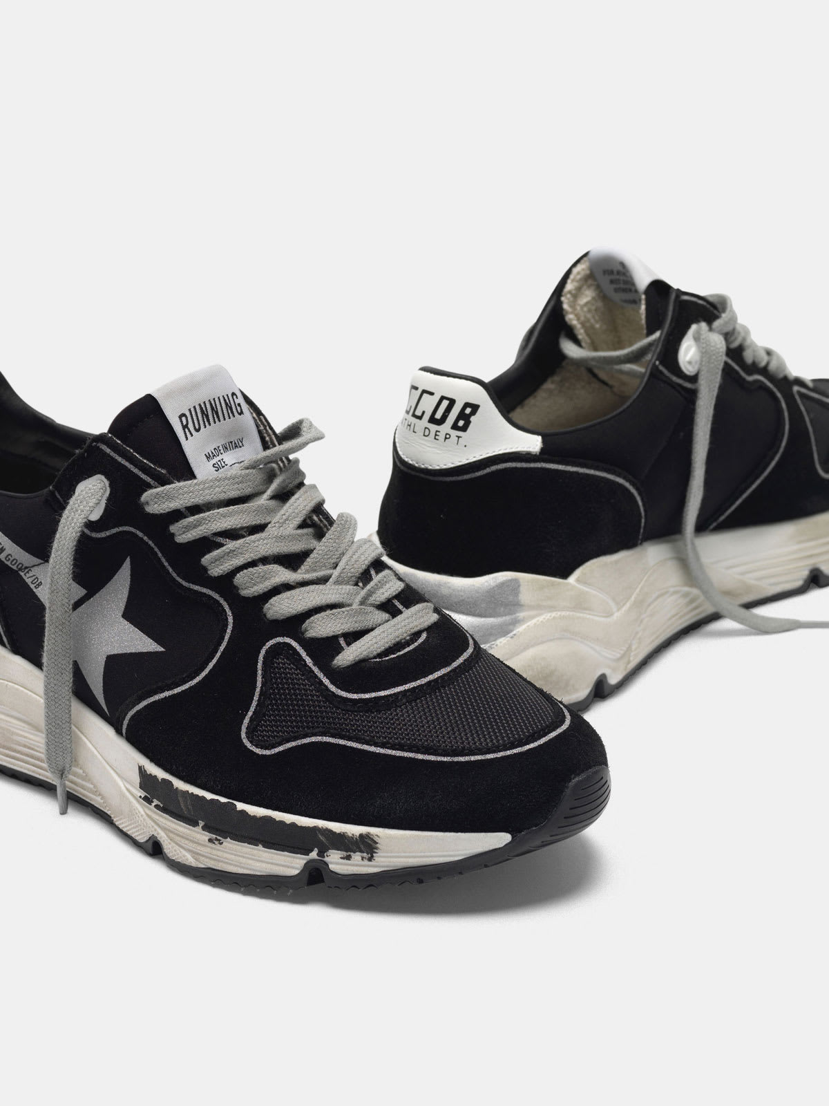 Black Running Sole sneakers with silver star