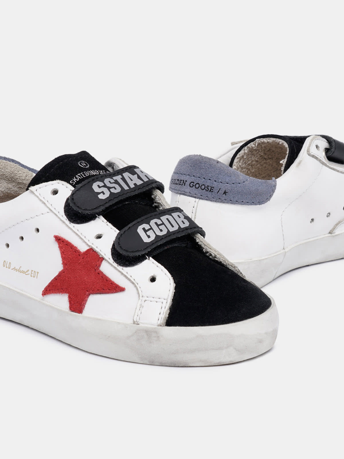 Black and white Old School sneakers with red star