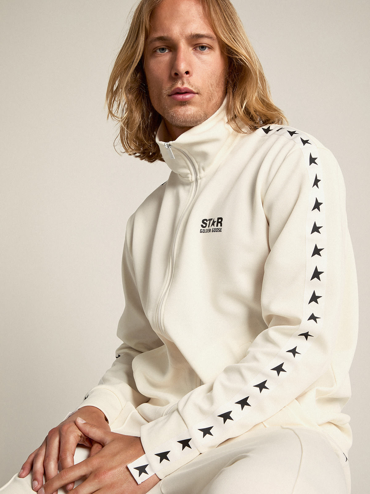 Men’s white zipped sweatshirt with white strip and black stars