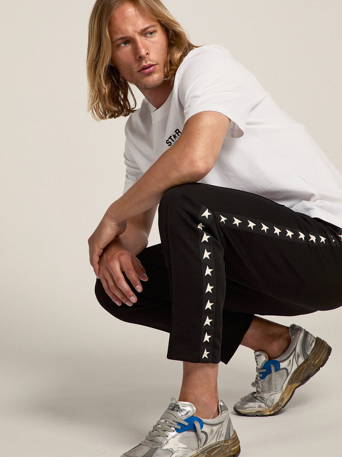 Golden Goose - Calça de jogging masculina preta com estrelas brancas nas laterais in 