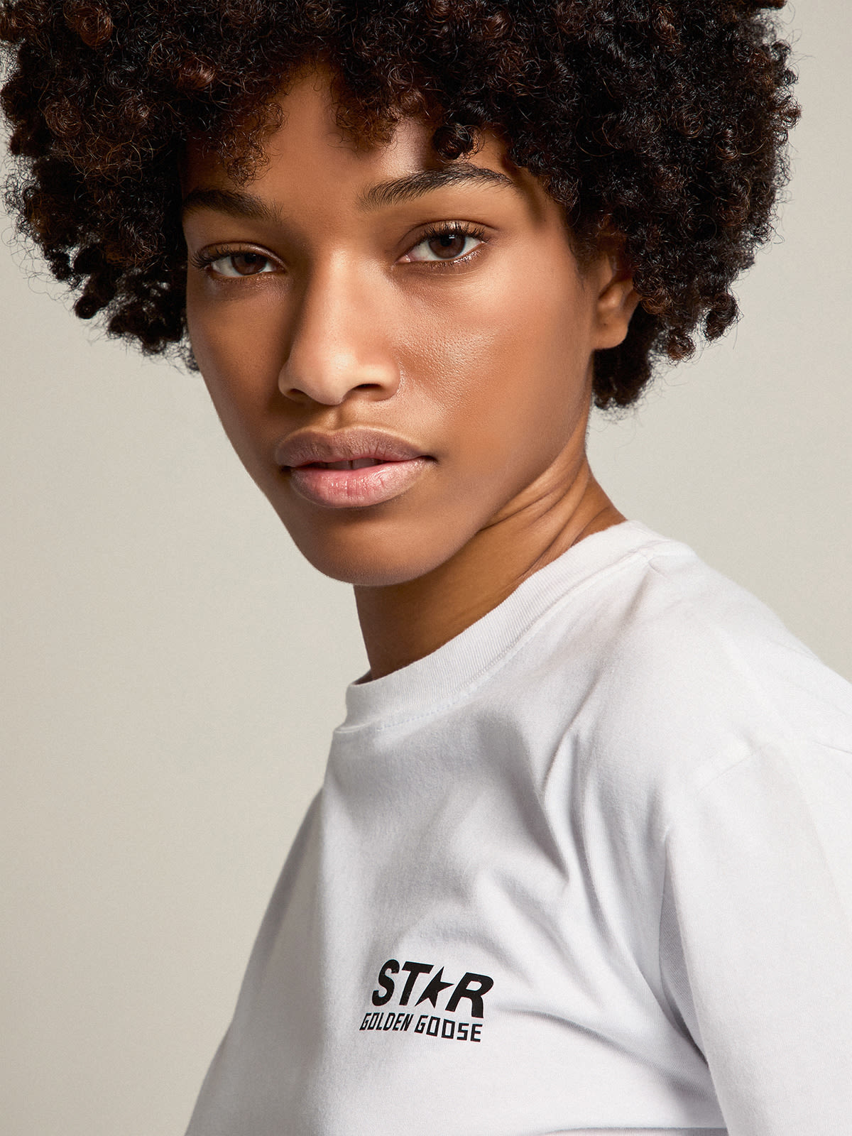 Women's white T-shirt with contrasting black logo and star