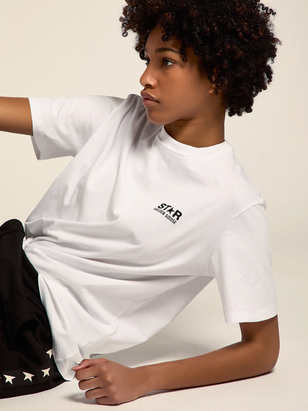 Women's white T-shirt with contrasting black logo and star