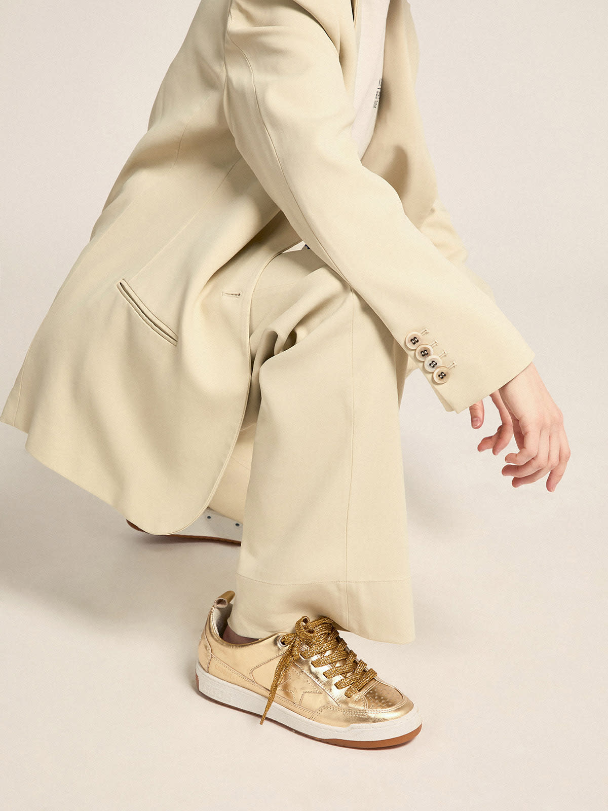 Yeah sneakers in gold laminated leather | Golden Goose