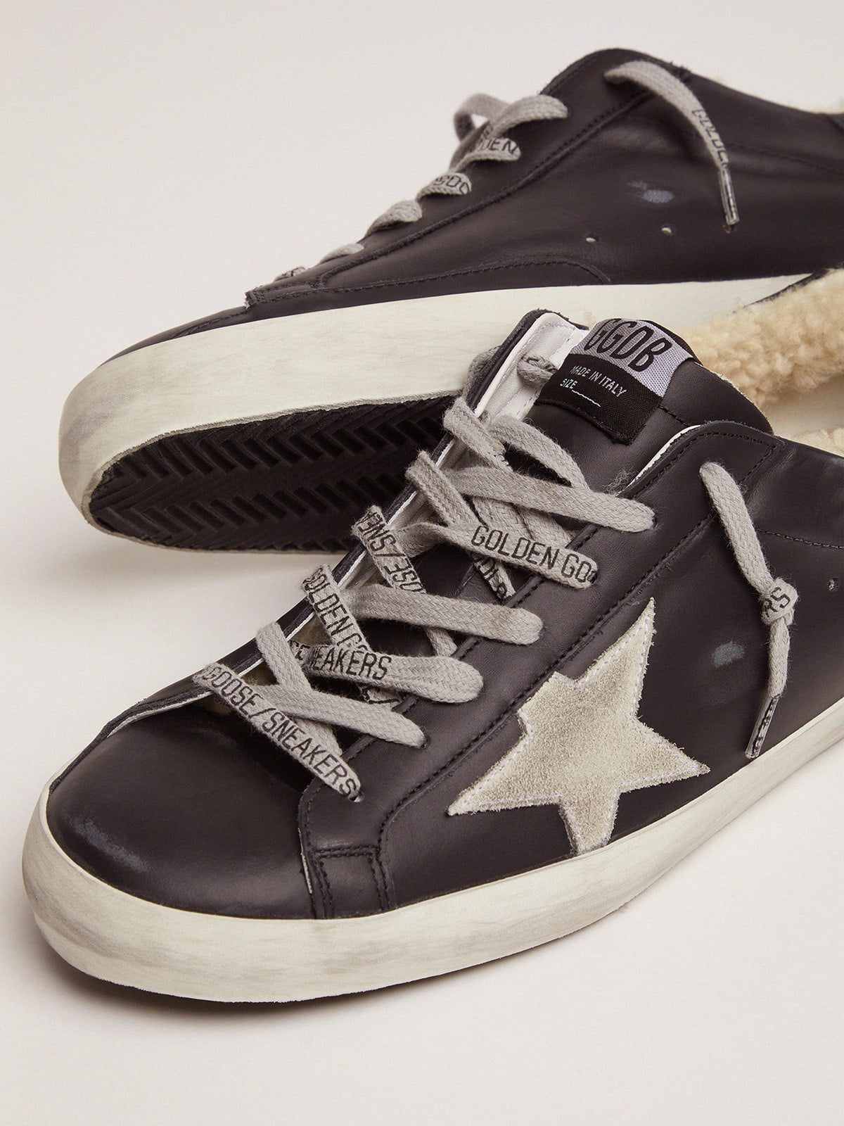 Golden goose black hot sale superstar sneakers