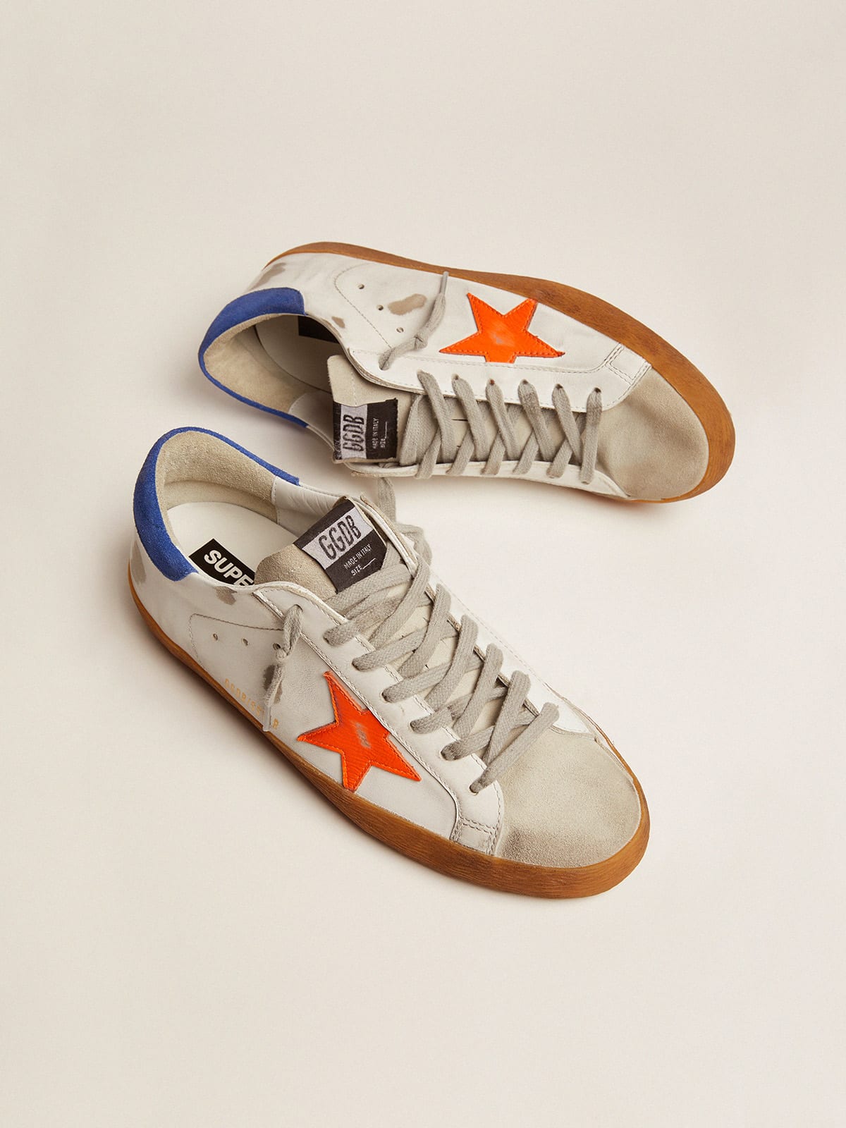 Super Star sneakers with blue suede heel tab and neon orange star