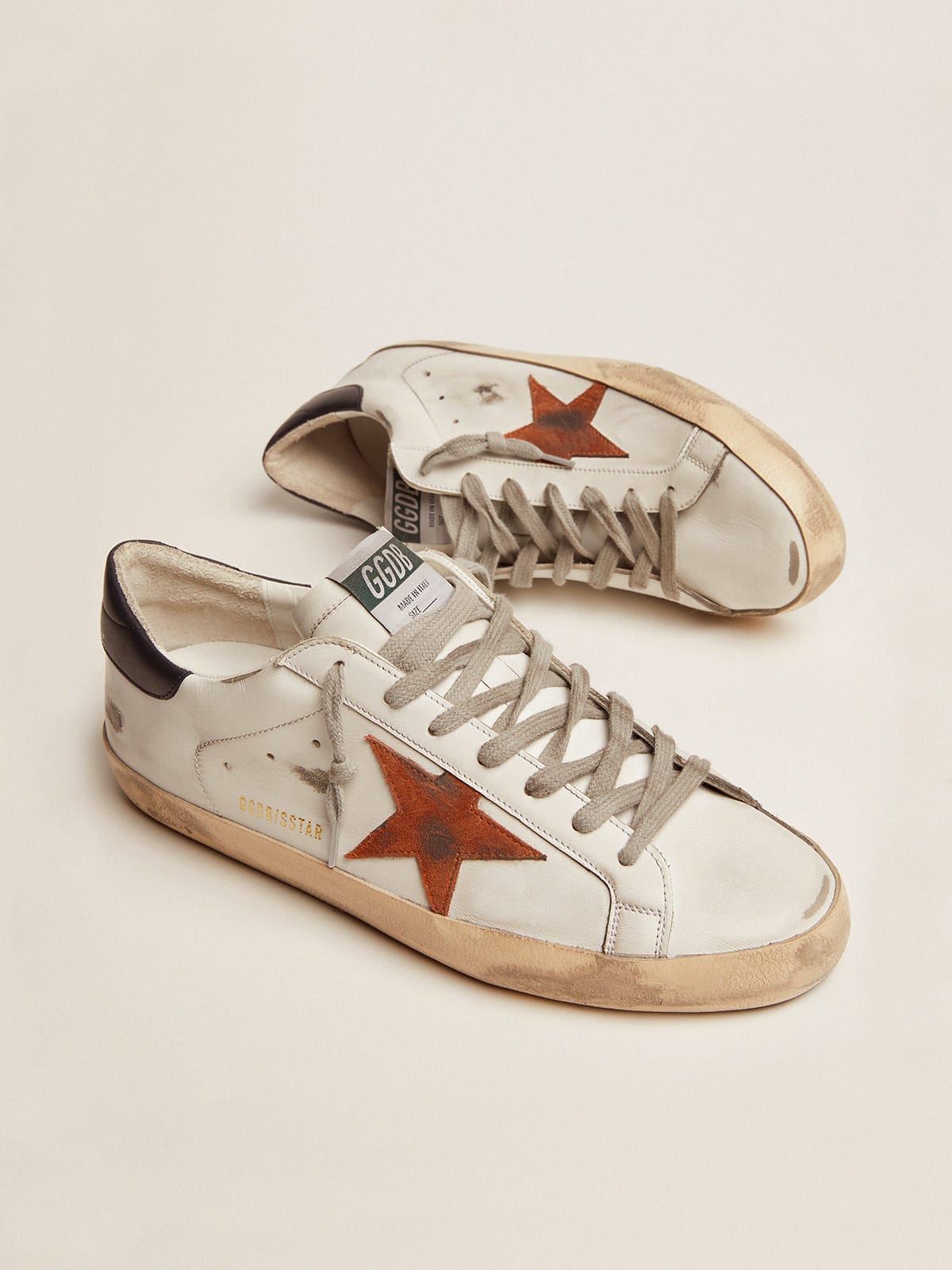 Super-Star with orange suede star and dark blue leather heel tab