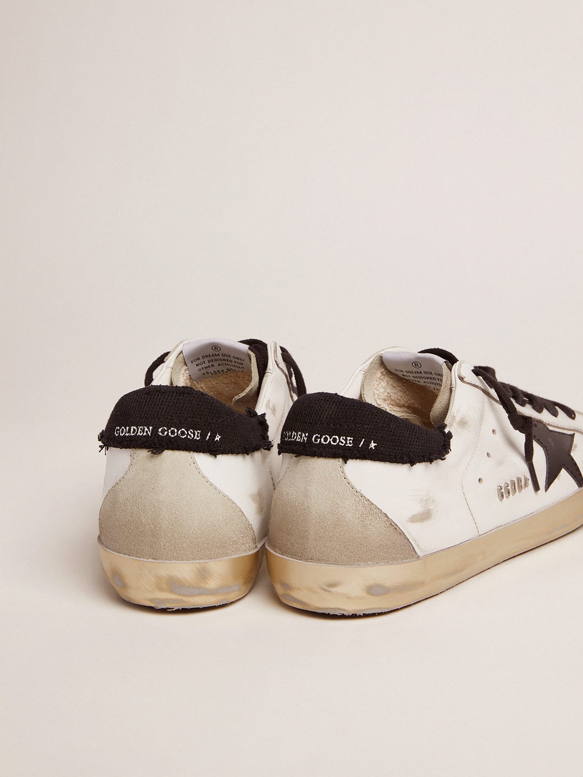 Super-Star sneakers in white leather with black distressed canvas heel tab