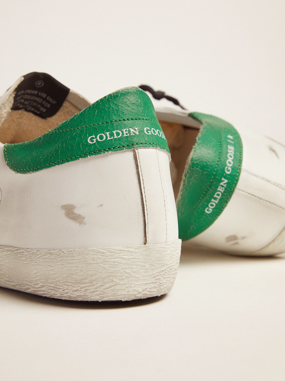 Super-Star sneakers with green crackle-effect heel tab | Golden Goose