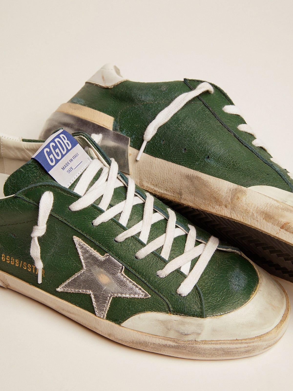 Super-Star sneakers in green leather and multi-foxing | Golden