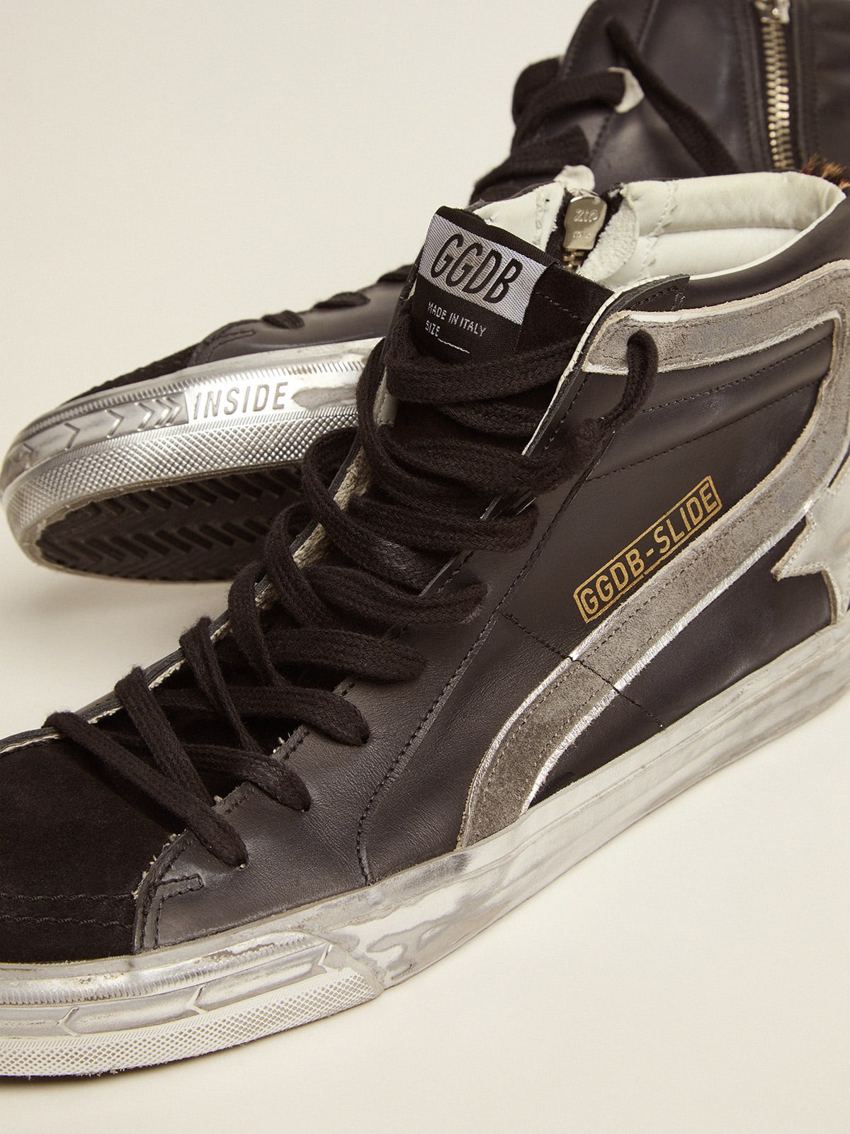 Slide sneakers in black leather with leopard-print pony skin heel tab |  Golden Goose