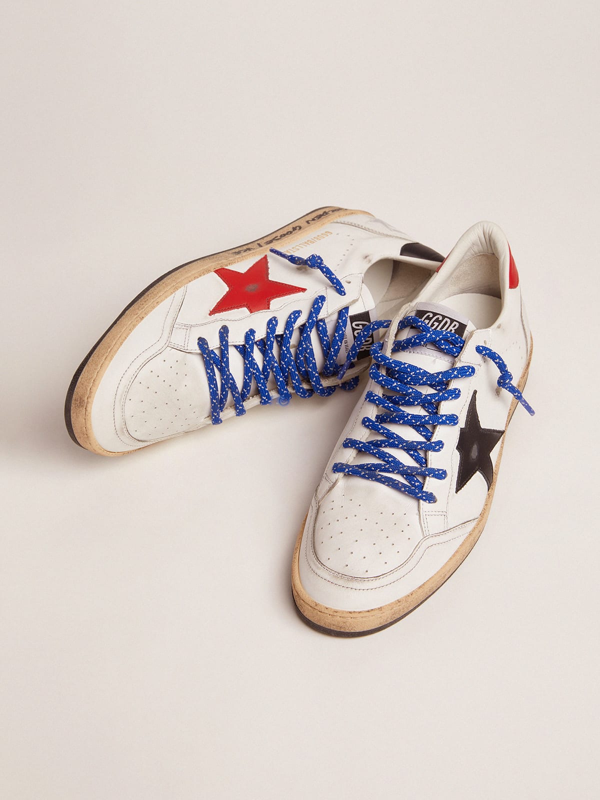 Ball Star sneakers in white leather with signature on the foxing and red  star | Golden Goose