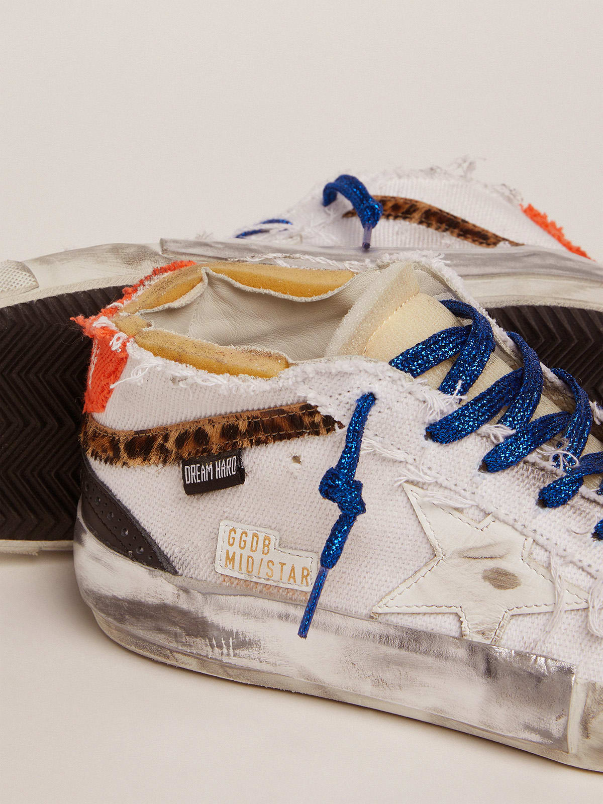 Golden Goose - Mid Star sneakers with white canvas upper and multi-foxing in 