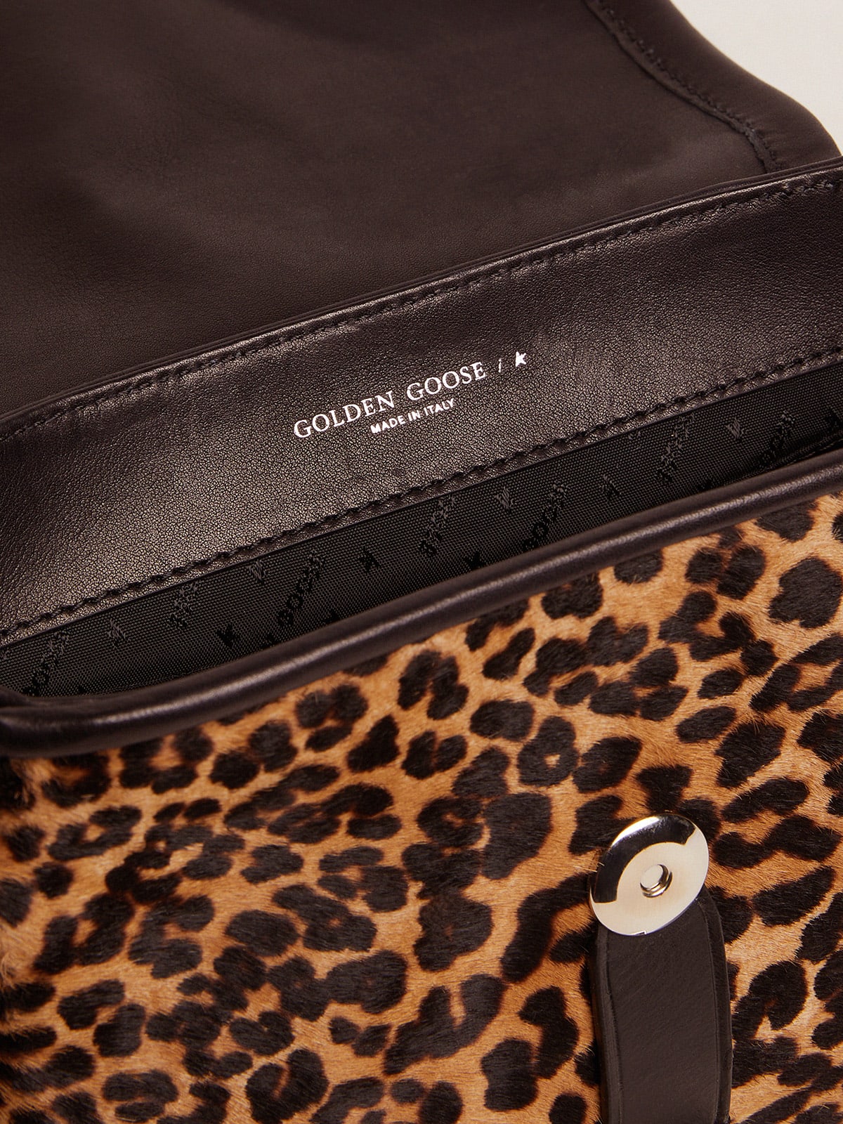 Golden Goose - Bolsa Rodeo pequena de couro preto e couro cavalinho com estampa de leopardo in 