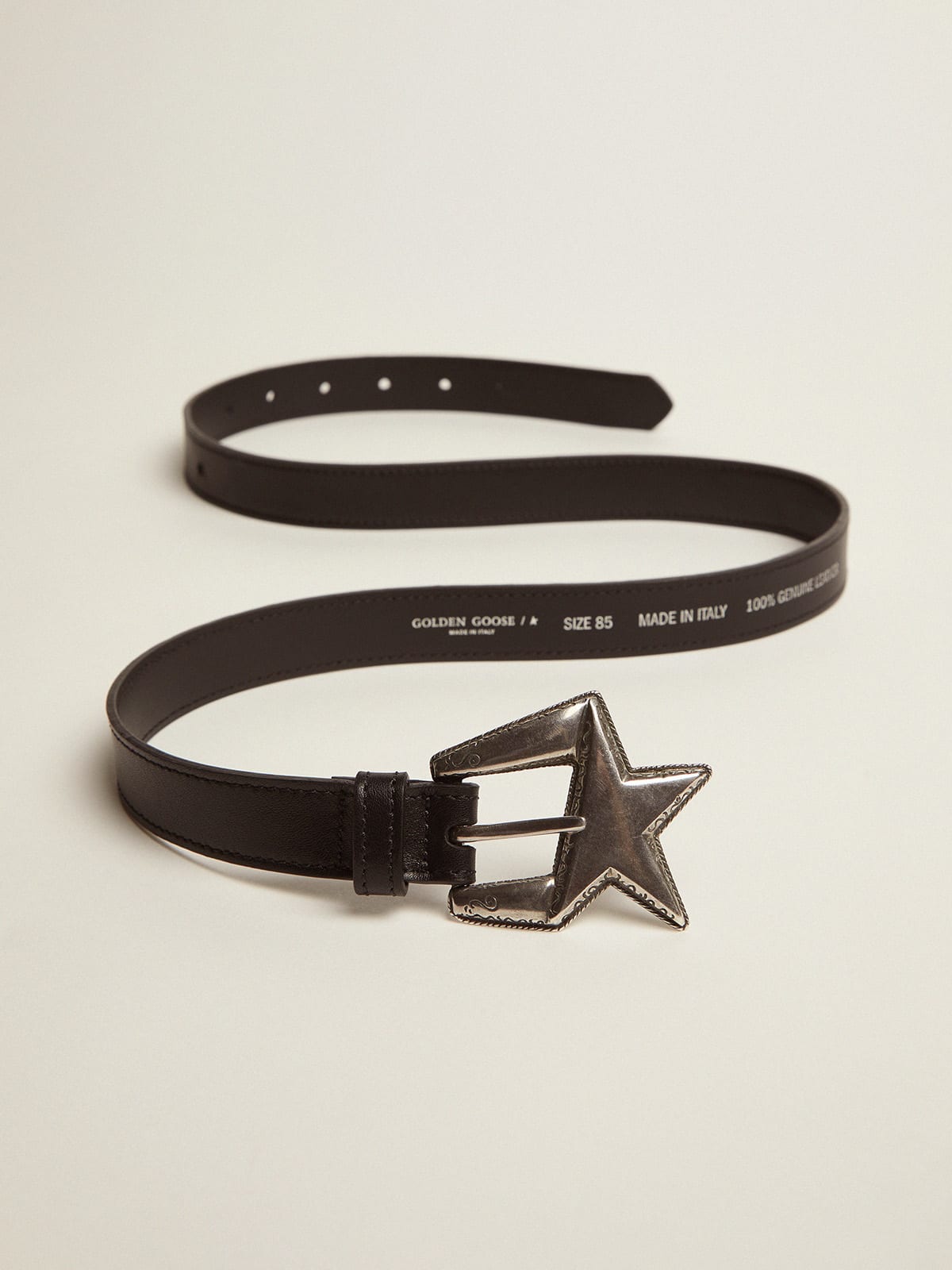 Black leather belt with star-shaped buckle