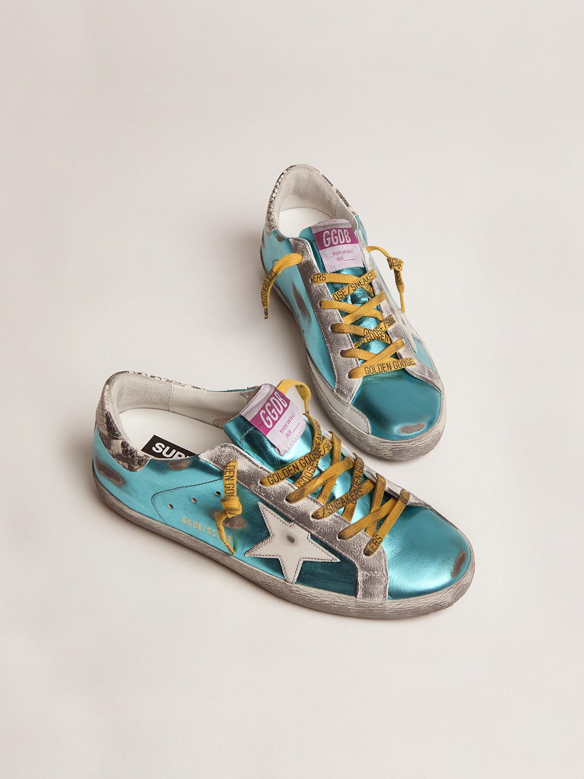 Turquoise green laminated Super-Star LTD sneakers with snake-print heel tab  | Golden Goose