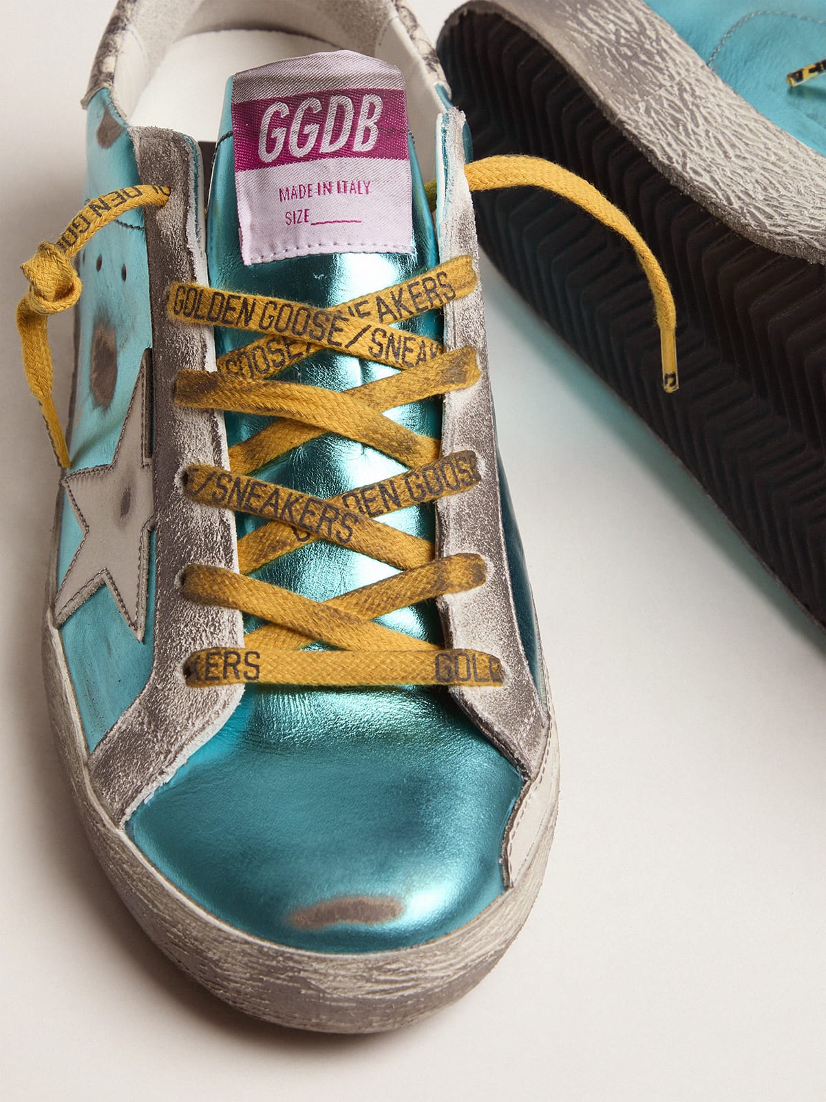 Turquoise green laminated Super-Star LTD sneakers with snake-print heel tab  | Golden Goose