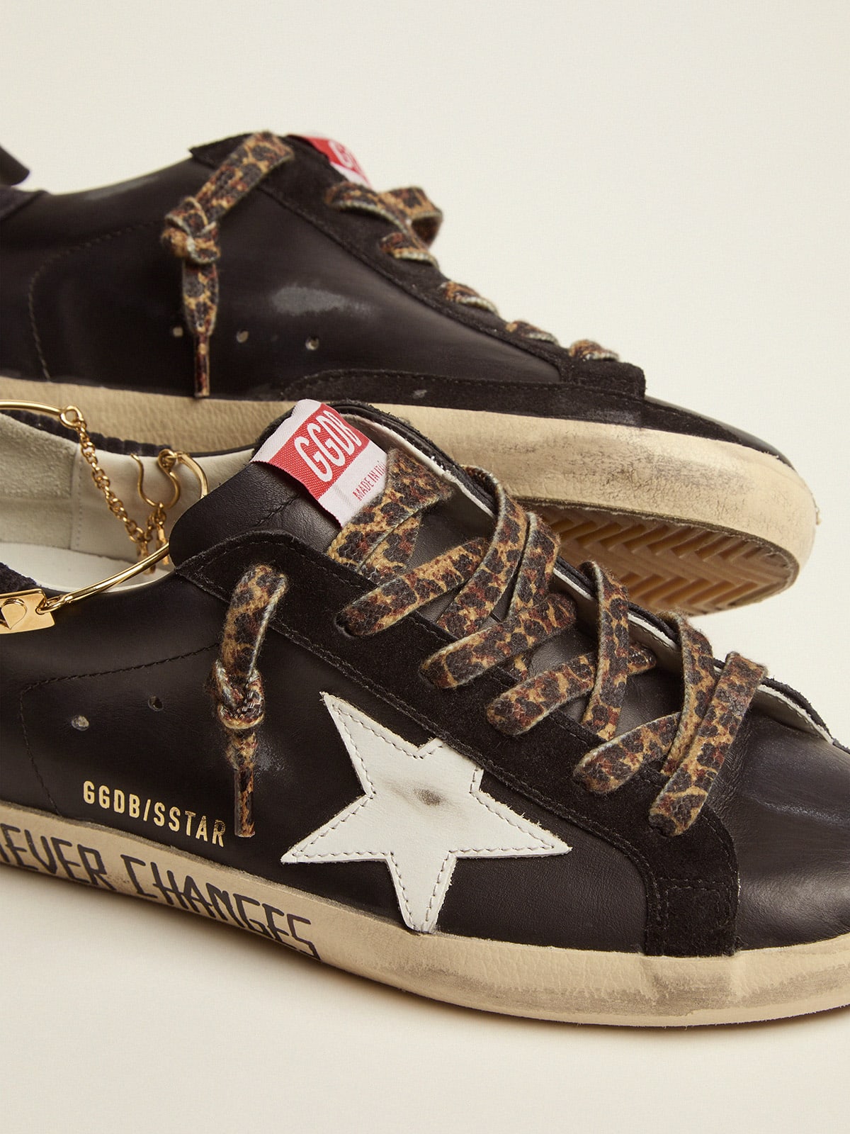 Golden Goose - Super-Star sneakers with black upper and gold ankle guard in 