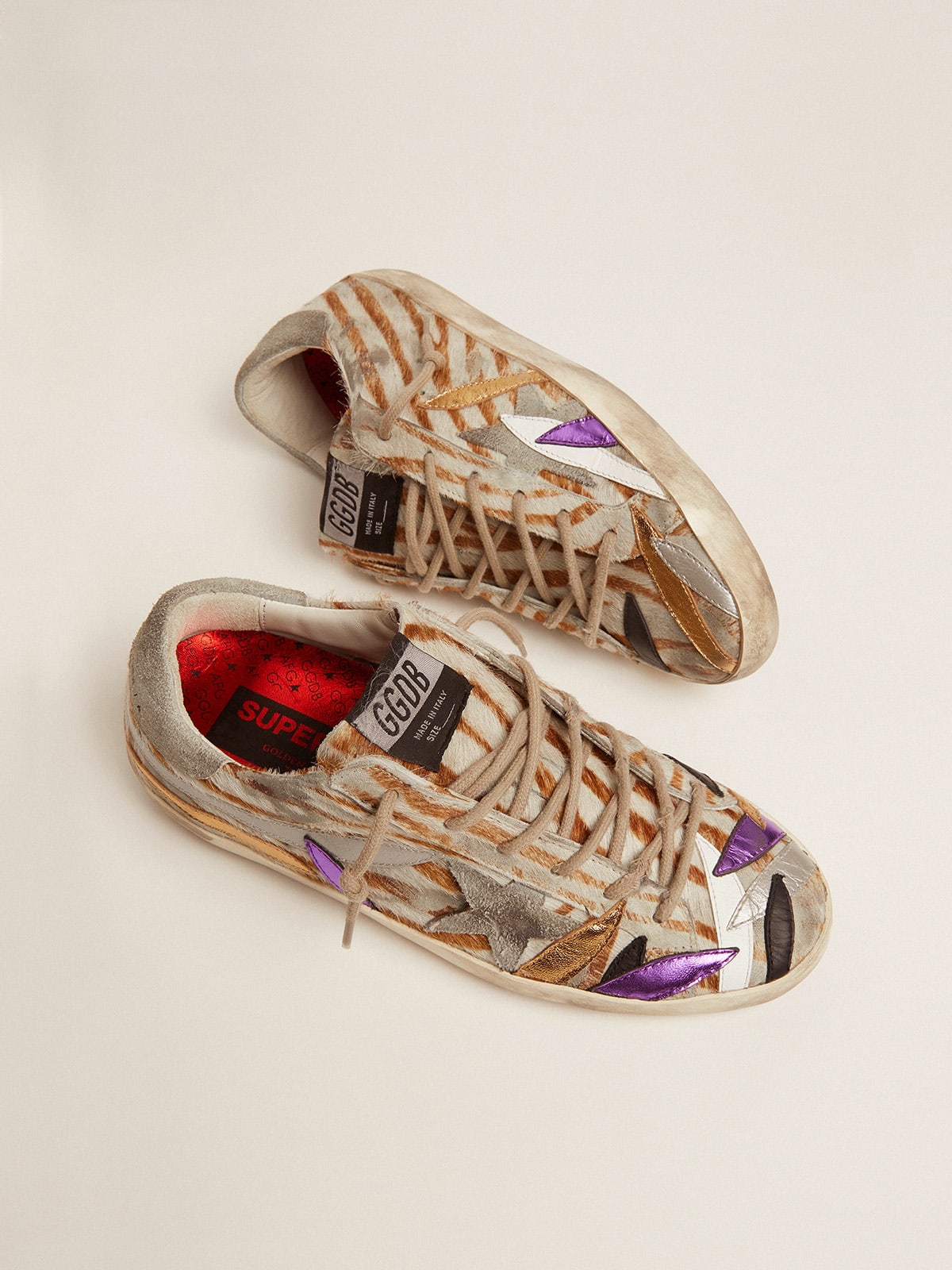 Super-Star sneakers in zebra-print pony skin with colored laminated leather  petals | Golden Goose