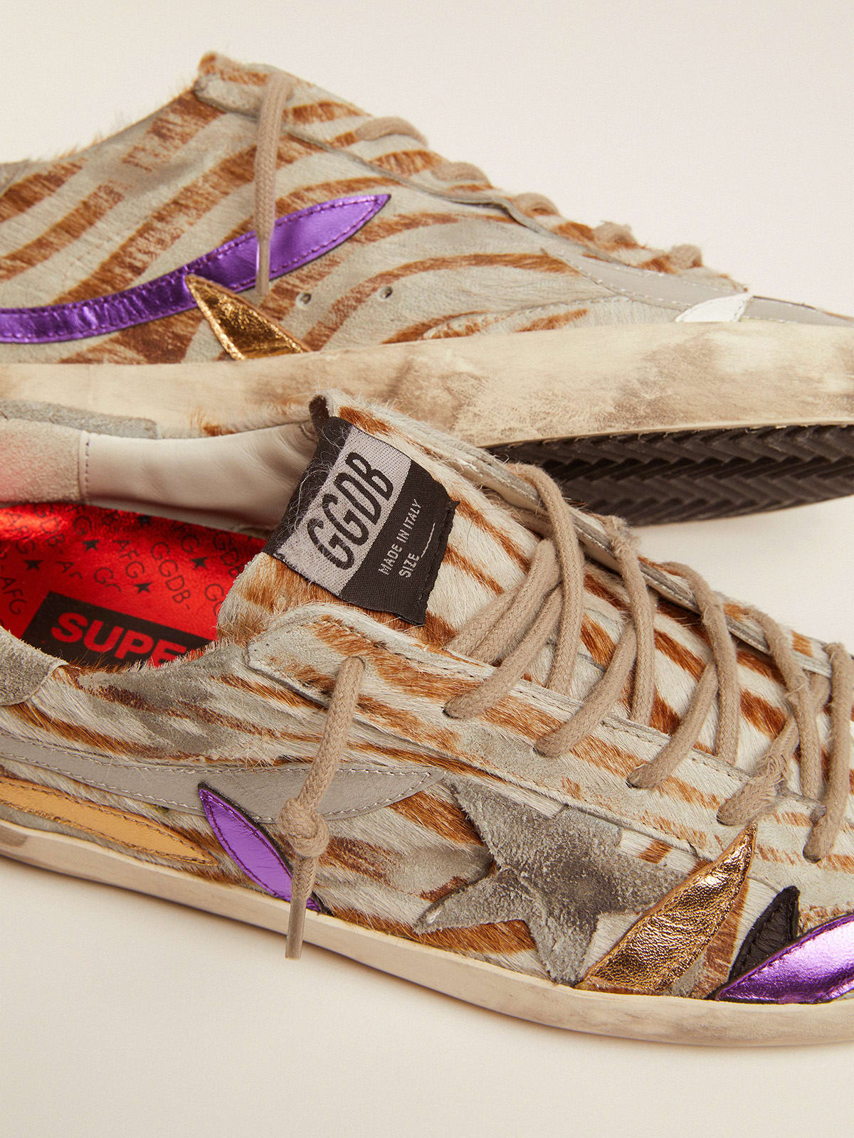 Super-Star sneakers in zebra-print pony skin with colored laminated leather  petals | Golden Goose