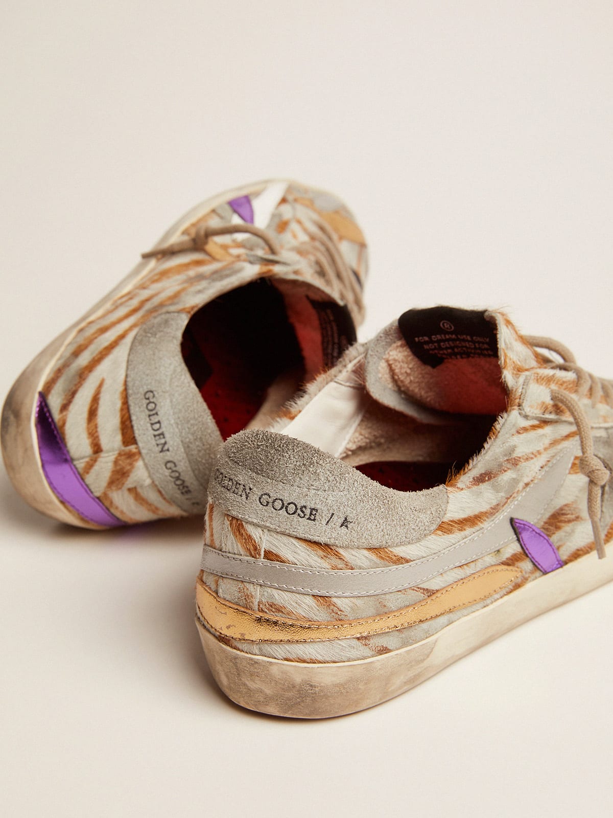 Super-Star sneakers in zebra-print pony skin with colored laminated leather  petals | Golden Goose