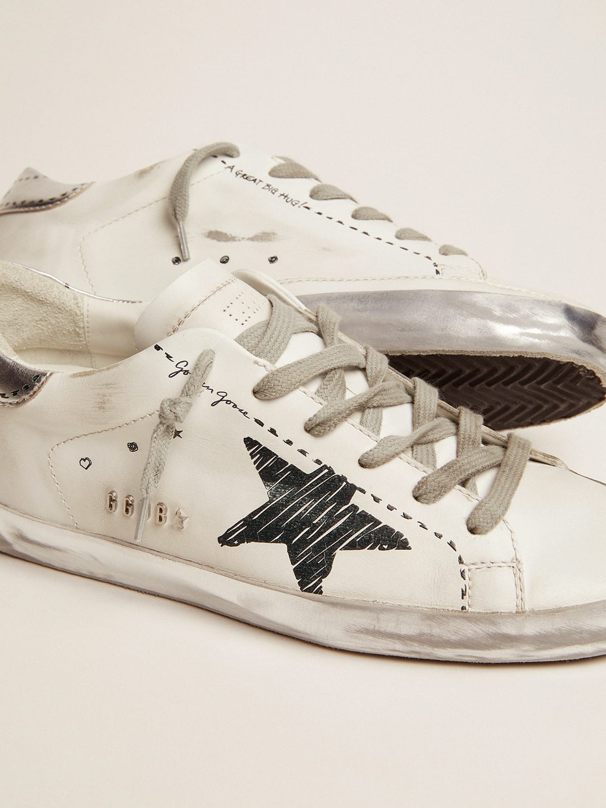Super-Star sneakers with silver laminated leather heel tab and printed  detail | Golden Goose