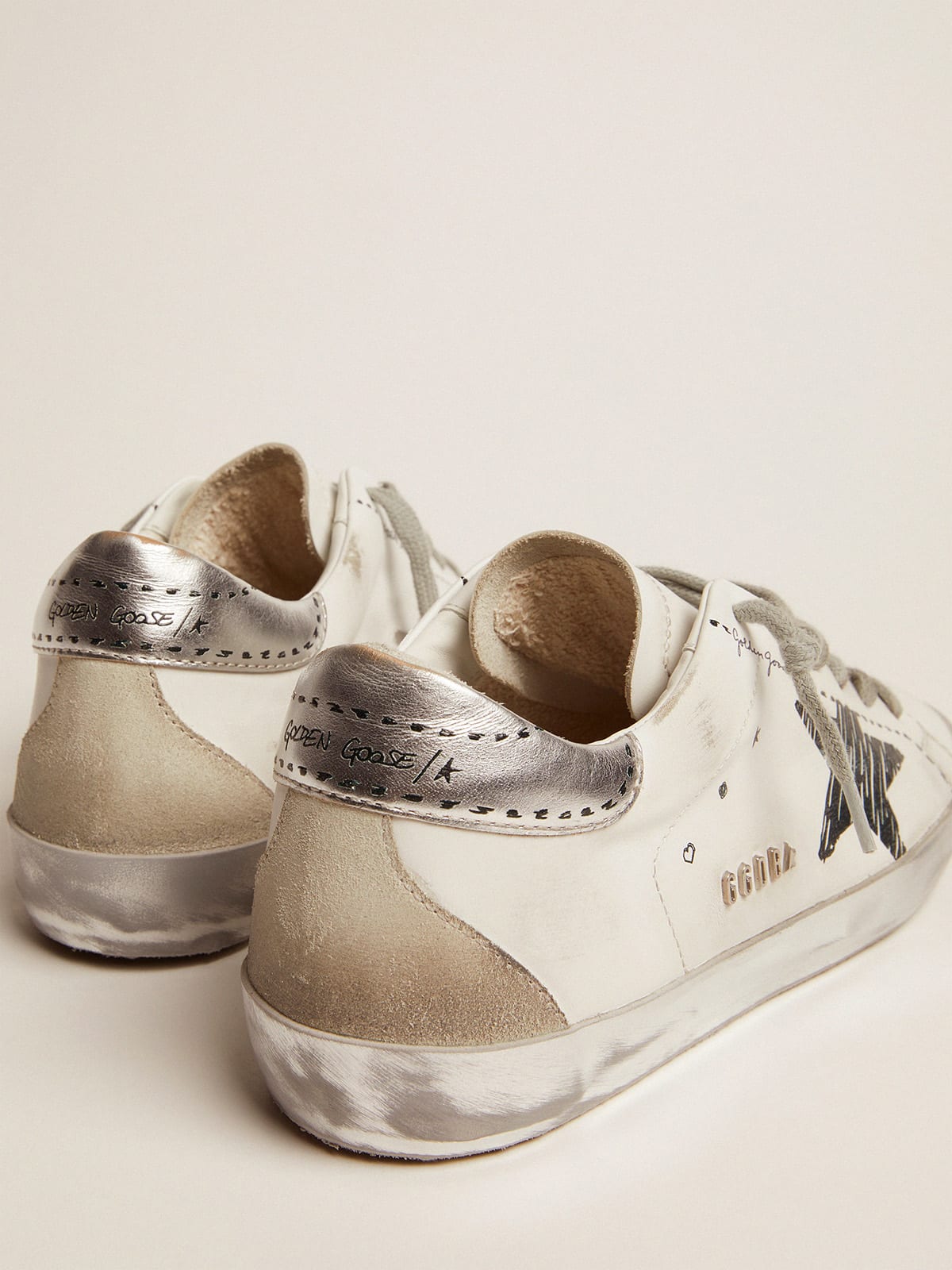 Golden goose superstar leather shop sneakers with metallic back