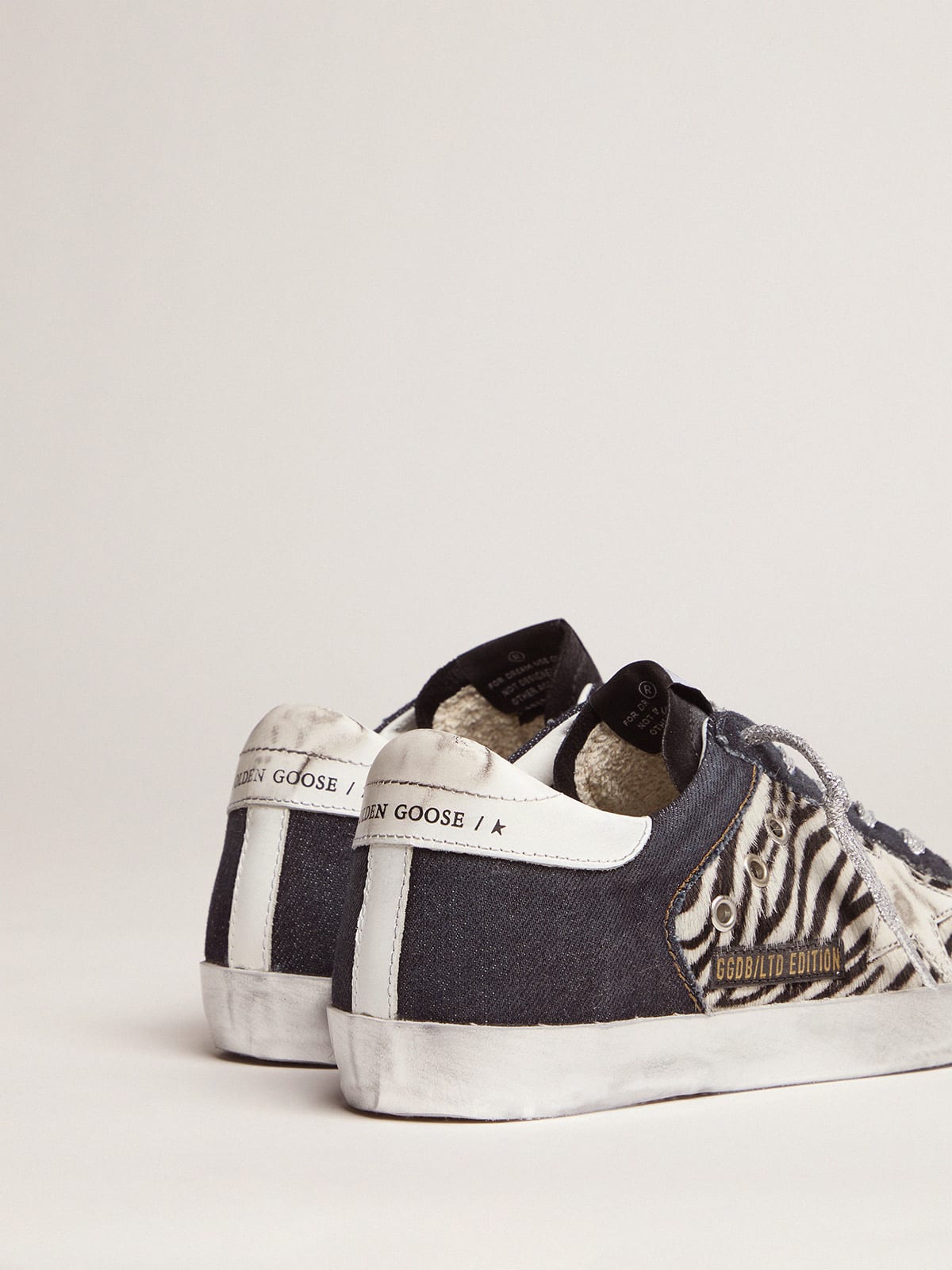 Golden goose zebra on sale print superstar sneakers