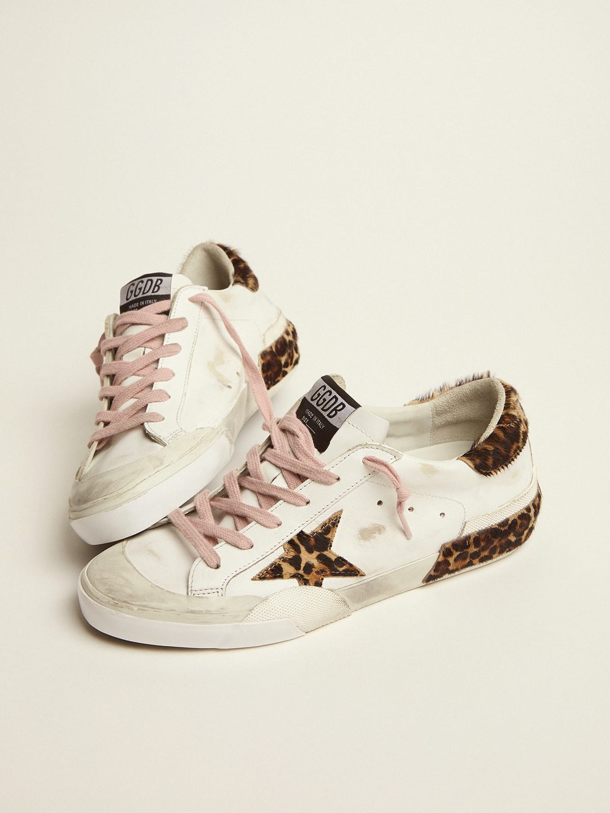 Super-Star sneakers in white leather with details and multi-foxing in  leopard-print pony skin | Golden Goose