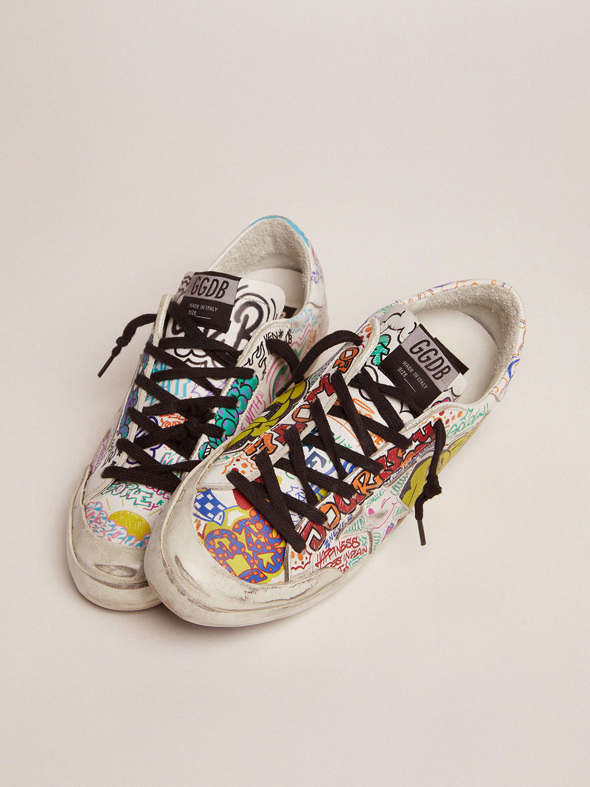 Super-Star sneakers in white leather with multicolored graffiti print |  Golden Goose