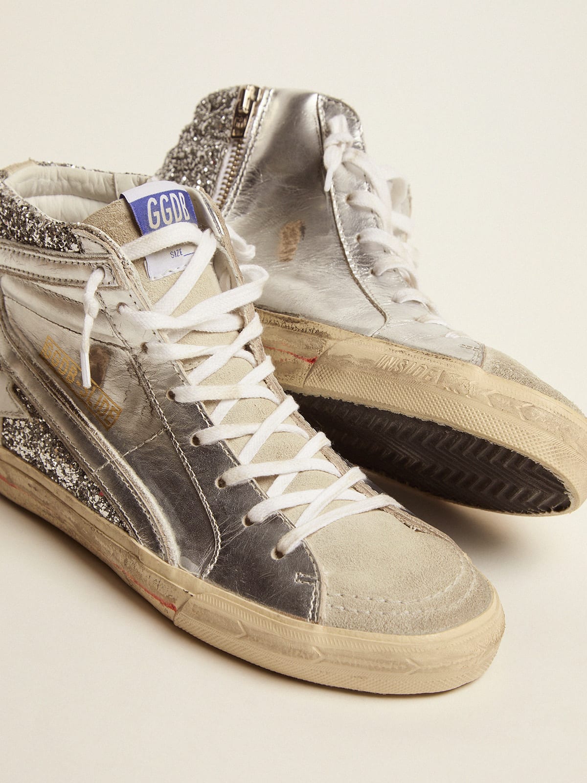 Slide sneakers with upper in laminated leather and silver glitter 
