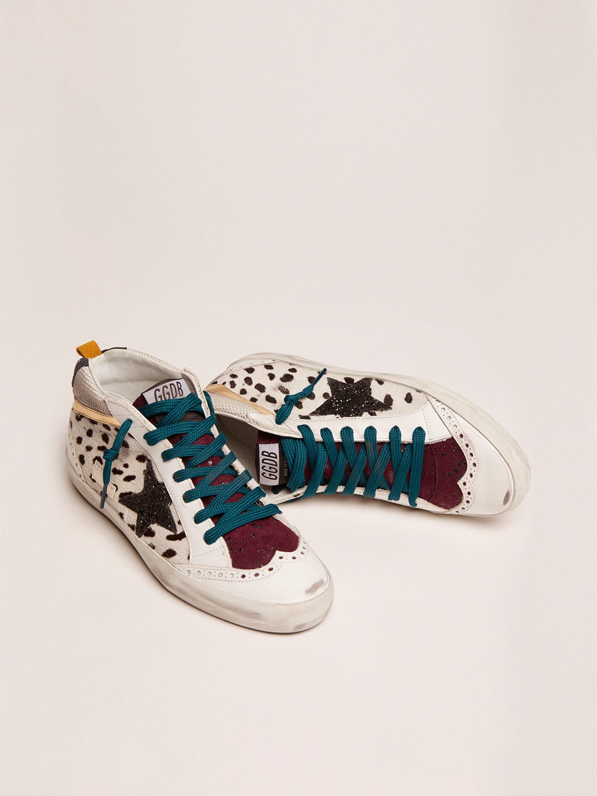 Mid Star sneakers with animal-print pony skin upper and glitter star |  Golden Goose