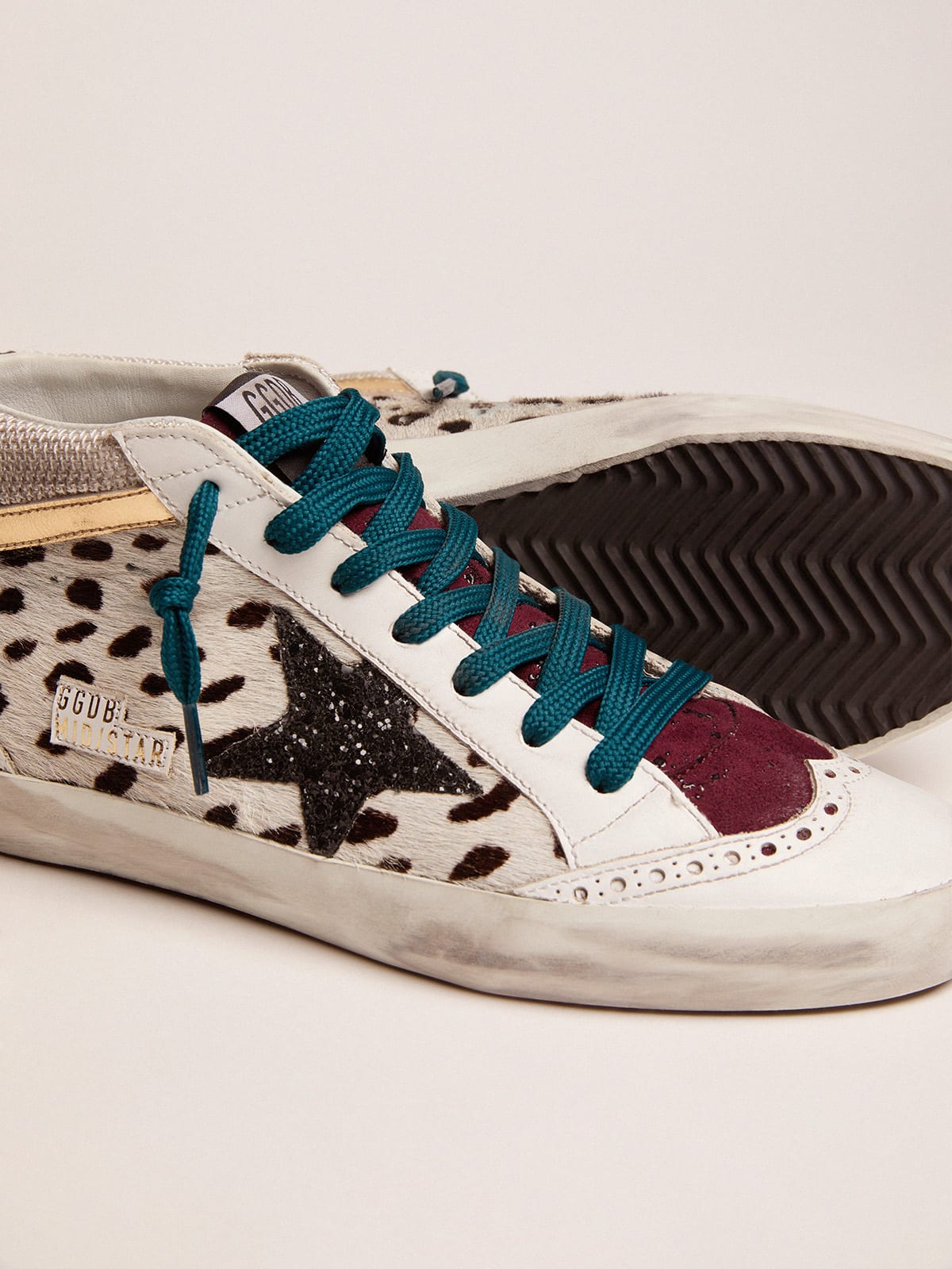 Mid Star sneakers with animal-print pony skin upper and glitter star |  Golden Goose