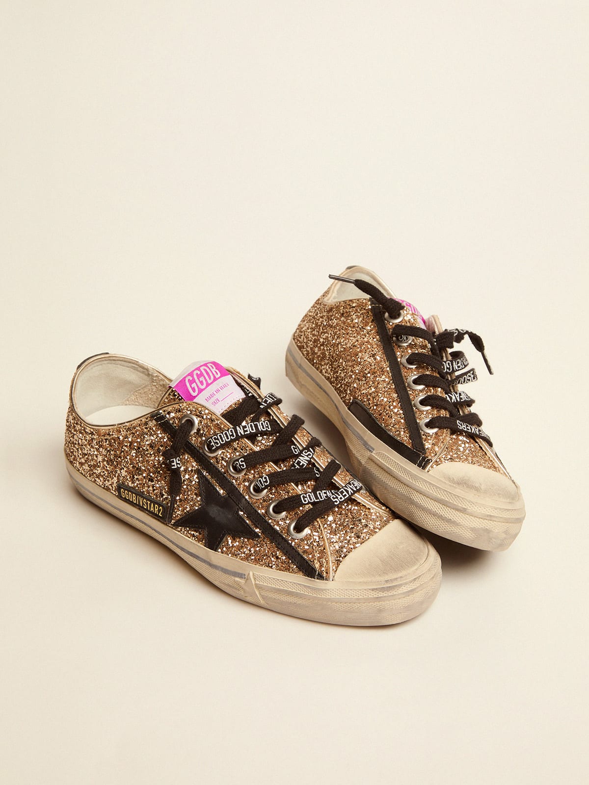 V-star LTD sneakers in gold glitter with black details | Golden Goose