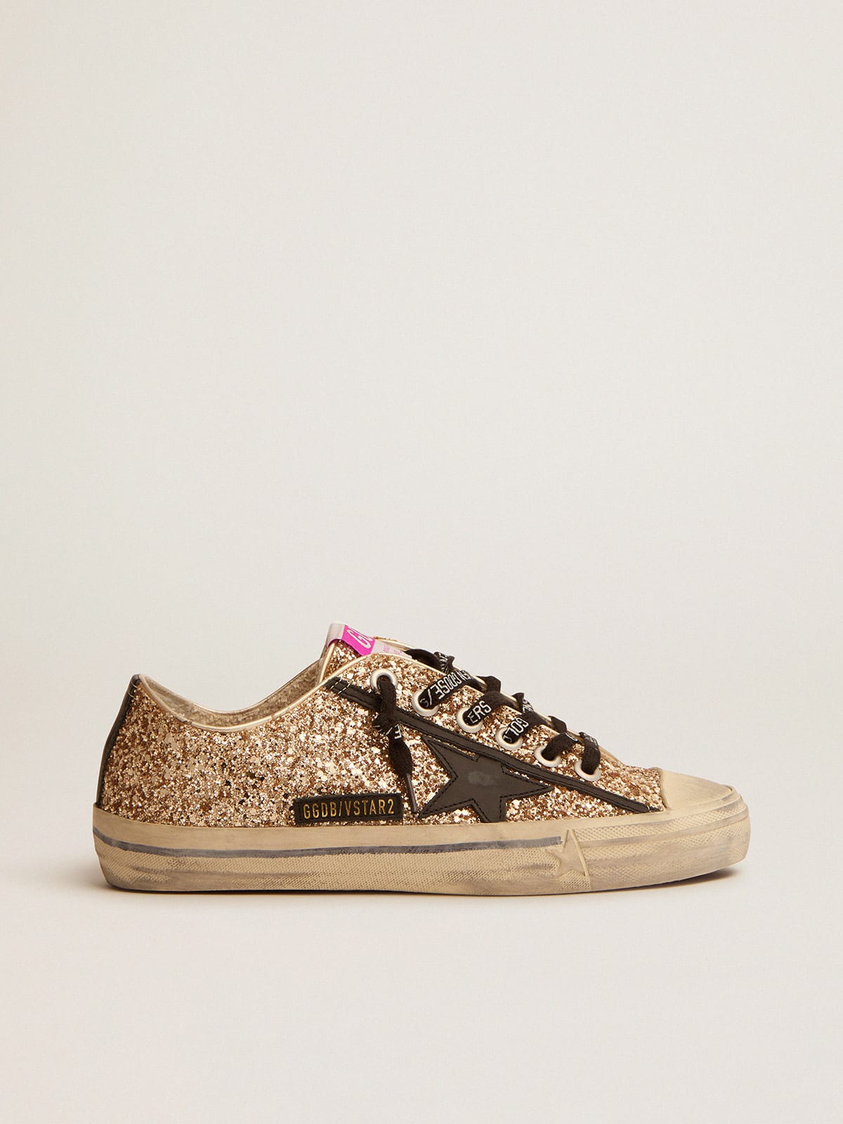 Sneakers with best sale gold detail