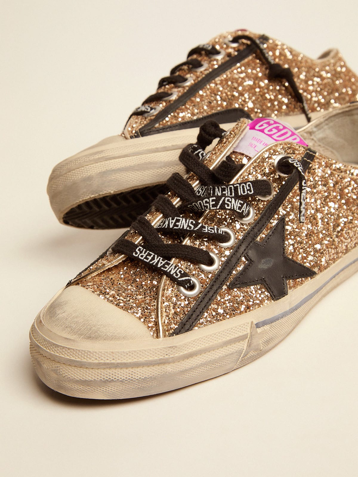 V-star LTD sneakers in gold glitter with black details | Golden Goose