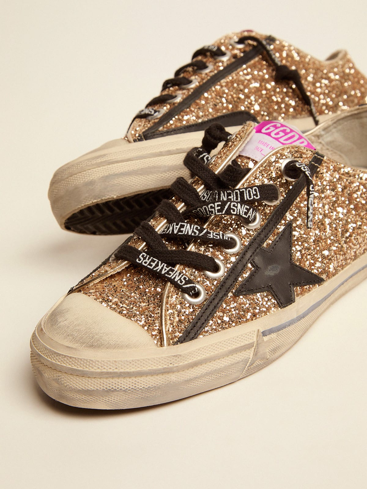 Golden goose black hot sale and gold sneakers