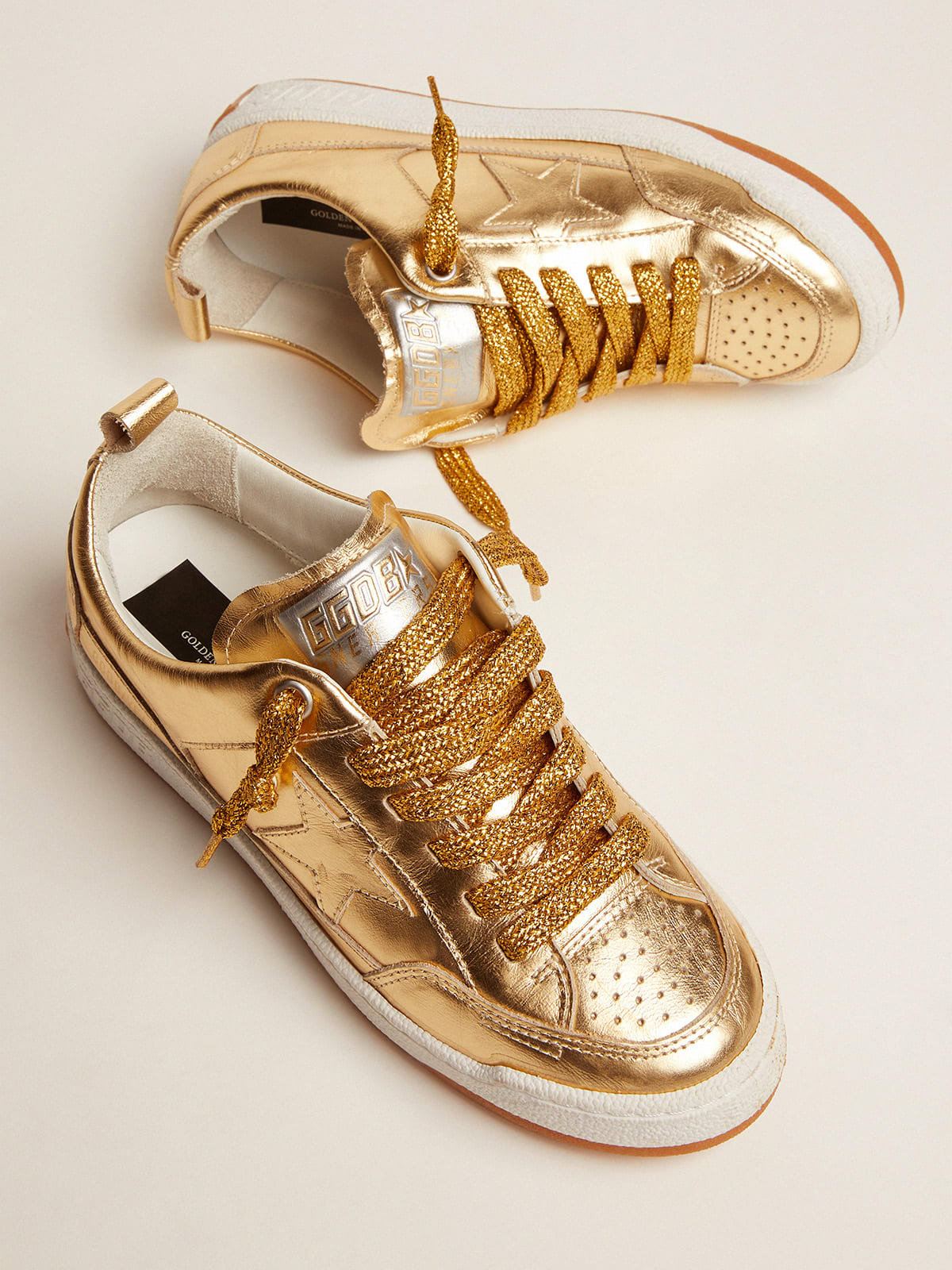 Yeah sneakers in gold laminated leather | Golden Goose