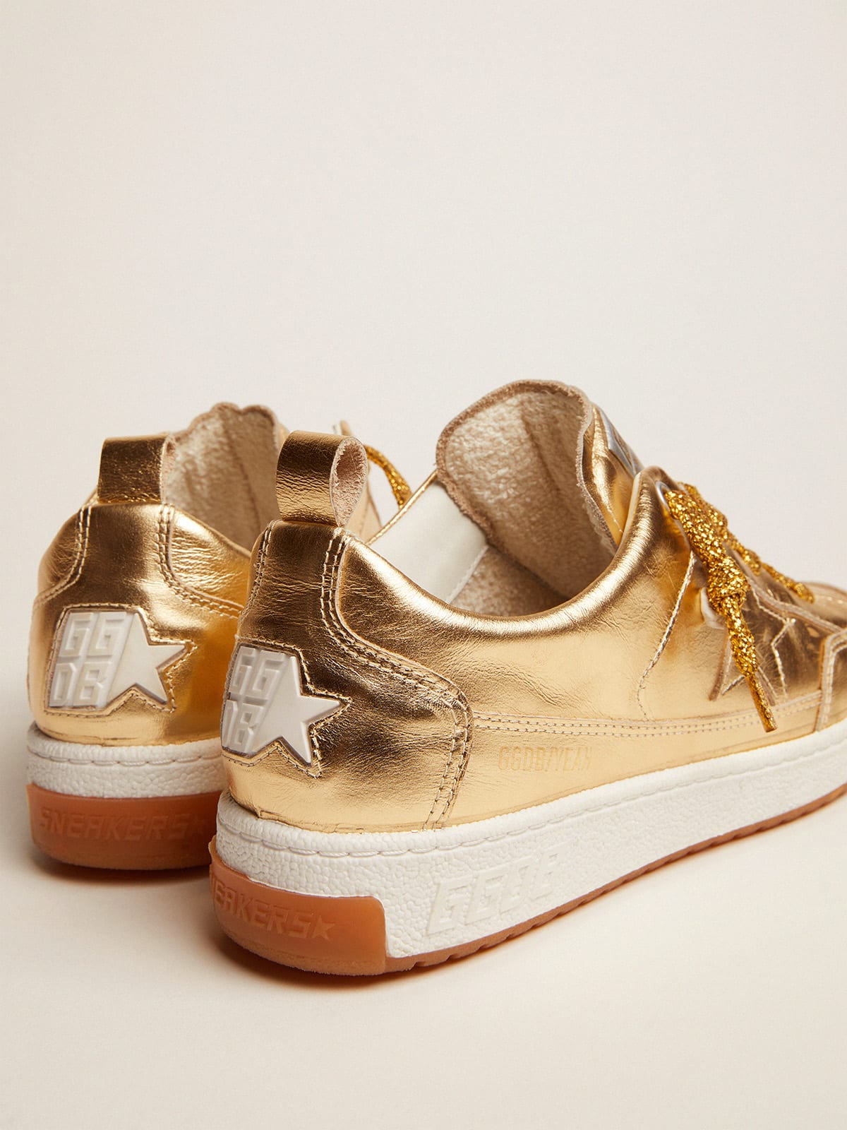 Yeah sneakers in gold laminated leather | Golden Goose