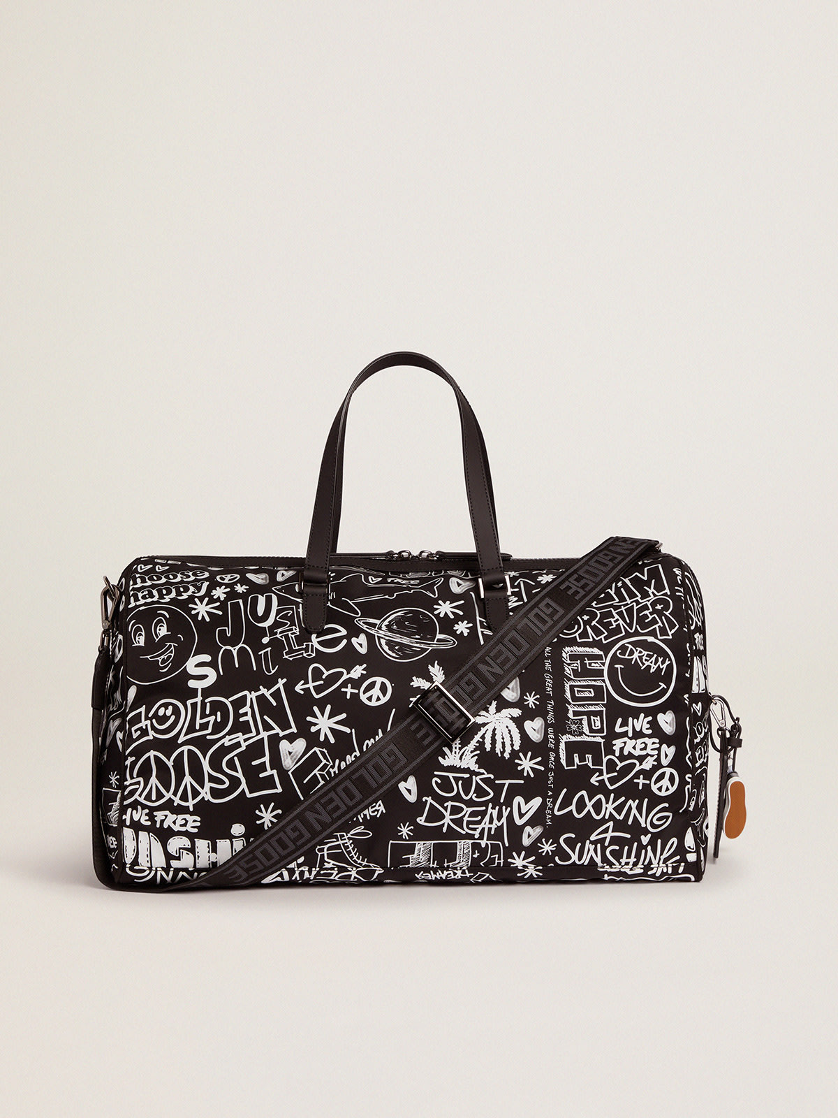 Journey duffle bag in black nylon with contrasting white decorations